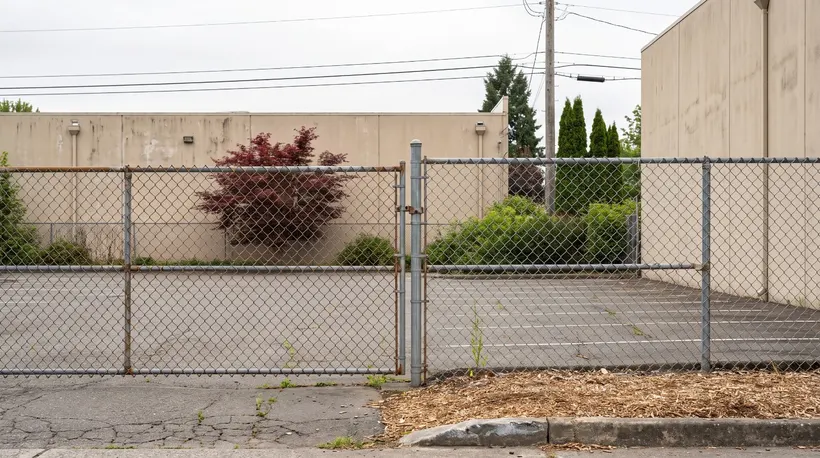 A fenced Mountain View industrial lot could become 36 rowhomes